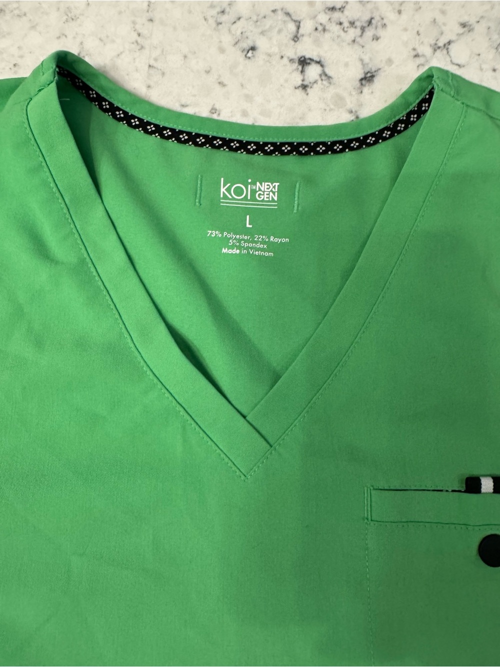 Koi Women’s L V-Neck Scrub Top in Green with black accents. Like new condition